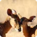 A playful group of goats grazing on lush green grass in a sunny farm setting.