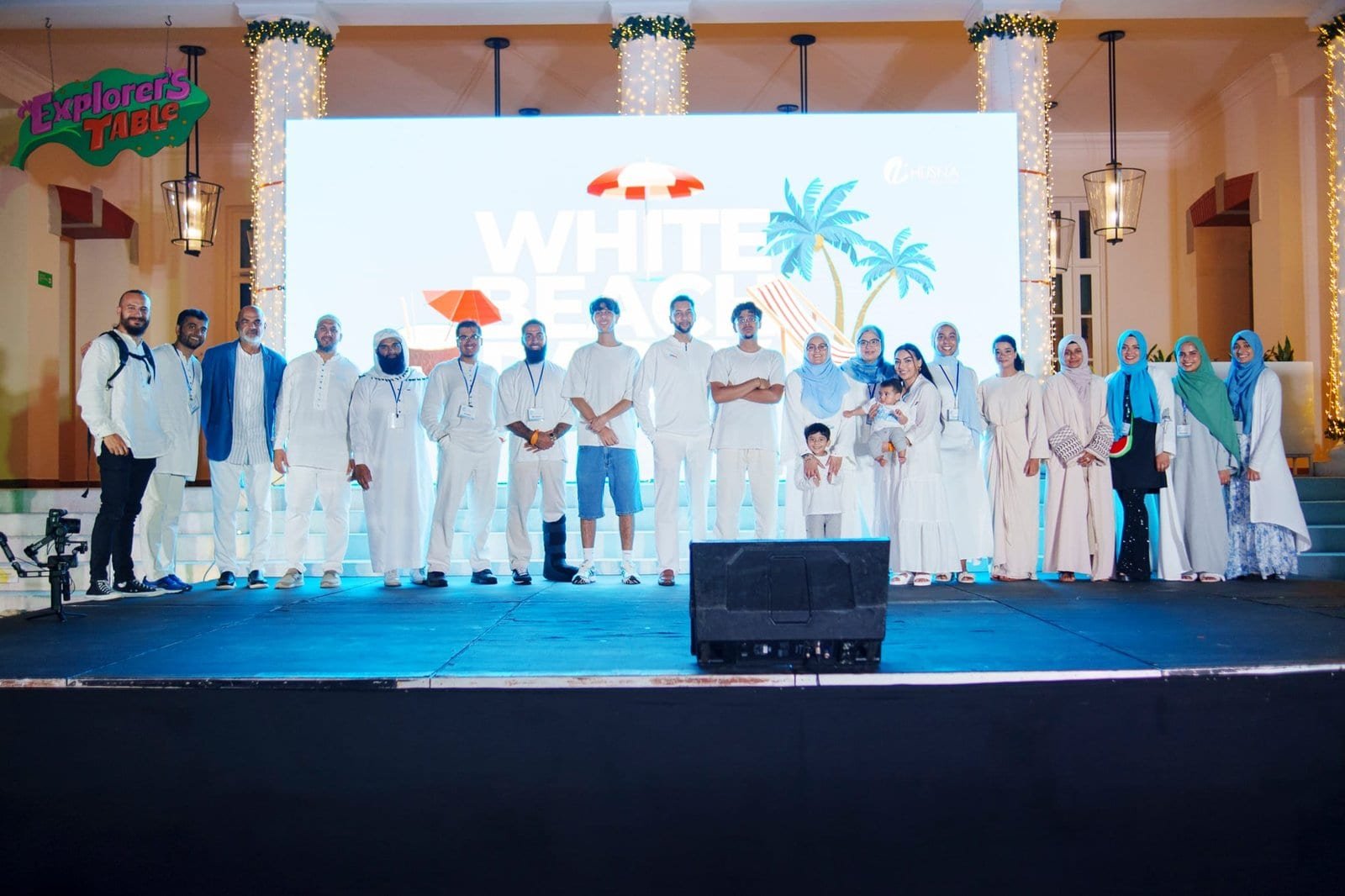 Group photo of Beach & Beyond Signature attendees on stage at The Husna Experience event.
